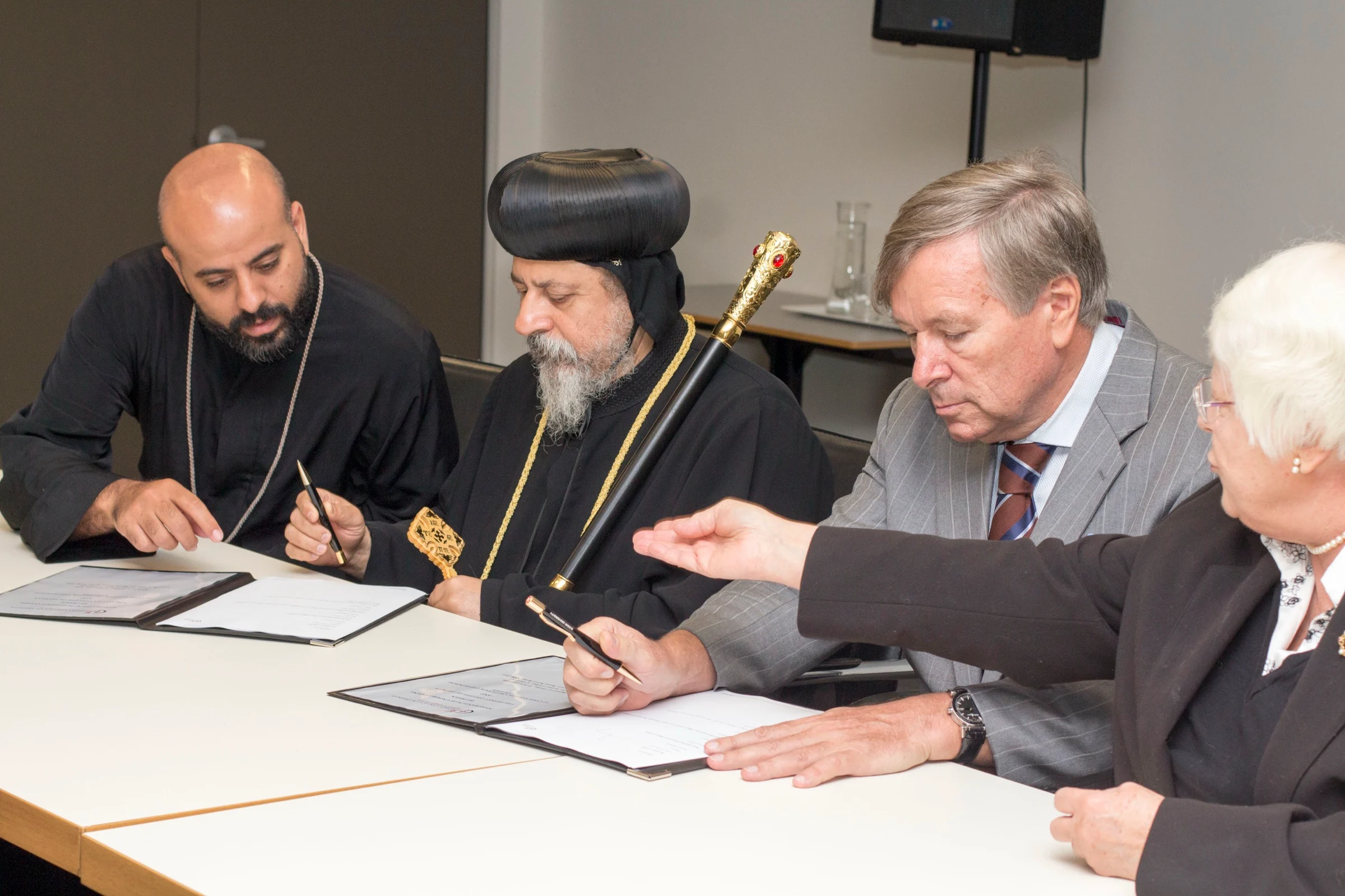 The President of St Cyril's and Dean of St Cyril's signing the MOU with the SCD