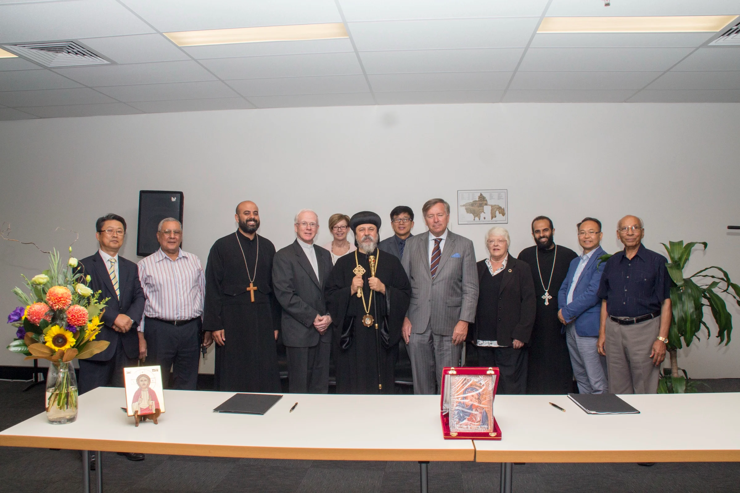 From left to right: St Cyril's Registrar (Mounir Azer) Dean (Fr. Daniel Fanous), President (Bishop Daniel), Director of Ministry (Fr Mark Basily), and Secretary of the College Council (Saad Sefein), with members of SCD (now AUCD) leadership.