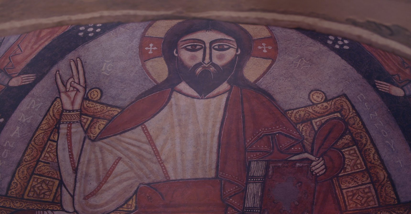 Coptic wall painting of Christ enthroned, his right hand raised in blessing